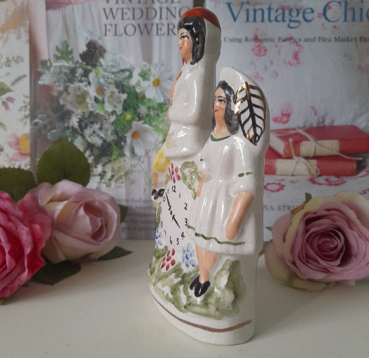 Antique Staffordshire Figurines of Man & Woman with Clock