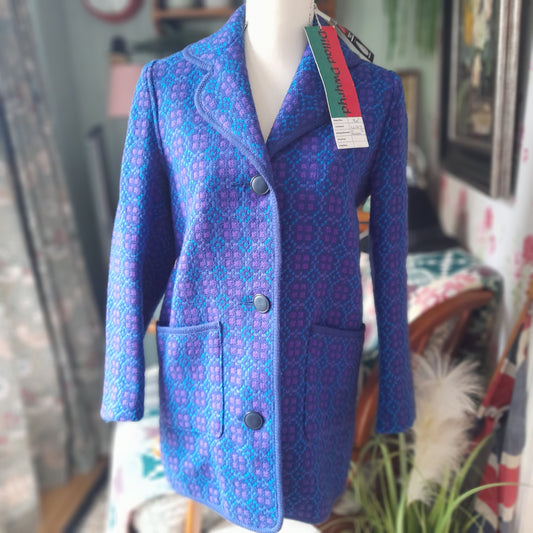 Blue vintage Welsh tapestry coat with a visible brand tag